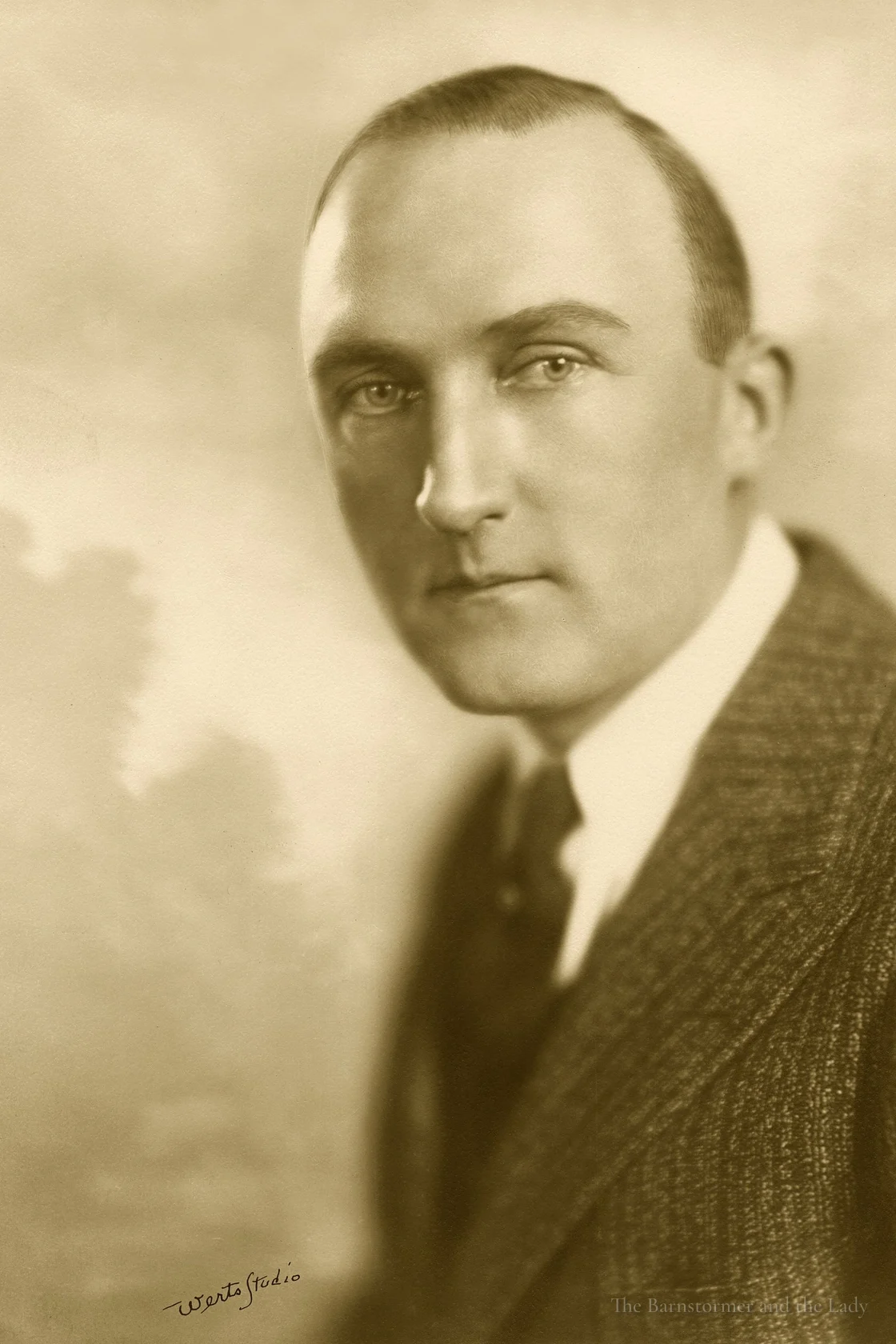 Studio portrait of Walter Beech in a tweed jacket and tie